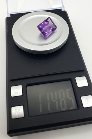 weighing-amethyst-gemstone